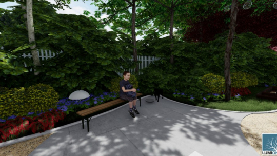 Wizualizacja parku kieszonkowego - na ławeczce siedzi dziecko, za nim ściana z roślin